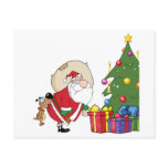 Dog Biting A Santa Claus Under A Christmas Tree postcards