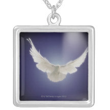 Dove flying through beam of light necklaces