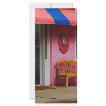 Dress Shop With Orange and Blue Awning rack cards