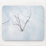 Dried branch on a snowy landscape mouse mat