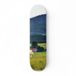 Drinking Cows On Pasture With A Hill In The Backgr skateboards