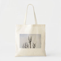 Dry Tree silhouette against cloudy sky Bags
