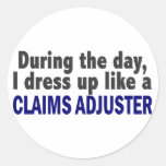 During The Day I Dress Up Like A Claims Adjuster Round Sticker
