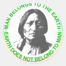 Earth does not belong to man round sticker