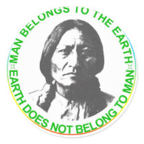 Earth does not belong to man round sticker