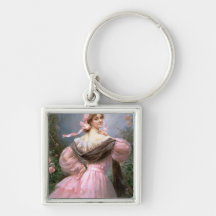 Elegant woman in a rose garden keychain