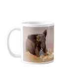 Elephant playing with water mugs