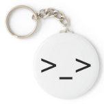 >_> Emoticon Keychain