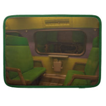 Empty Seats on Night Train - green yellow photo Sleeves For MacBooks