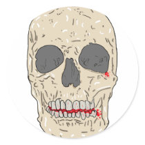 Evil, bloody and ravaged skull round stickers