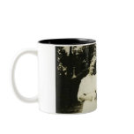 family holding cat mugs