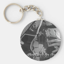 Female hand guitar on hip Text.jpg Keychains