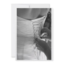 Female hand lacing up wedding dress back
