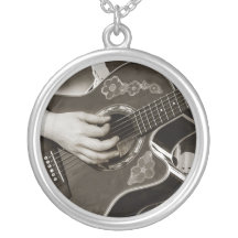 Female with acoustic  Guitar hand and hip view Necklace