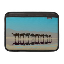 Few camels walking in desert MacBook sleeve