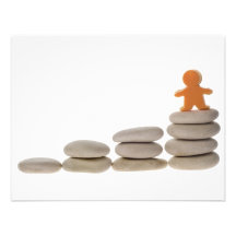 Figurine on stack of pebbles announcements