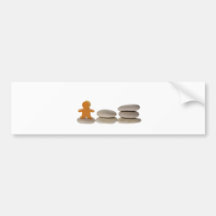 Figurine on stack of pebbles bumper stickers
