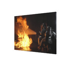 Firefighters extinguish a simulated battery fir stretched canvas print