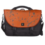 Flaky, scratched red paint. Faux rust and grunge commuterbag