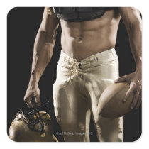 Football player with protective gear, football, stickers