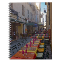 France, Corsica. Tables of cafe set up in narrow Notebooks