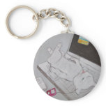 Frenchy resting on laptop keychains
