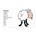 funny cute sheep sticking tongue out from behind business card