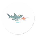 funny shark chasing fish round sticker