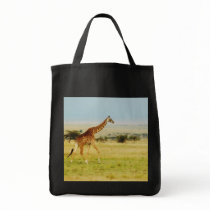 Giraffe walking Masai Mara Plains in Kenya Tote Bags