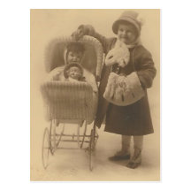 girl and her doll in carriage post card