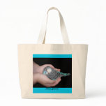 Girl holding baby budgie bag