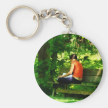 Girl Reading in Park Key Chains