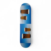 Glass filled with beer skateboard deck