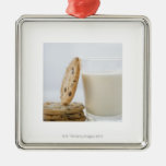 Glass of milk and cookies, close-up christmas tree ornaments