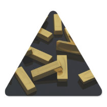 Gold bars in bulk on a black background triangle sticker