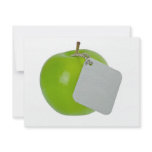 Green apple with metal tag invitations