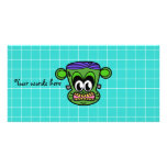 Green Frankenstein monkey on blue tile