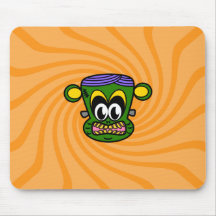 Green Frankenstein monkey on orange swirl Mousepads
