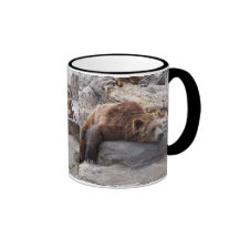 Grizzly Bear Resting On Rock Mugs
