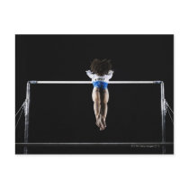 Gymnast (9-10) reaching for uneven bars post card