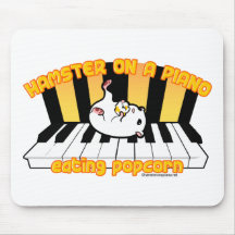Hamster on a piano eating popcorn mouse pads