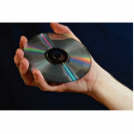 Hand holding a compact disc photo sculptures