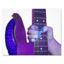 Hand holding bass guitar blue and purple photo