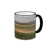 Hay Bales In A Field With Mountains At Sunrise Mugs