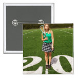 High school lacrosse player (16-18) holding buttons