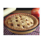 Home baked apple pie on cooling rack with apple postcards