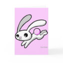 Hop the rabbit with fluffy pink tail greeting card