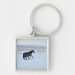 Horse and foal in the snow fantasy keychains