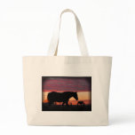 Horse at sunset tote bags