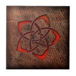 Hot orange celtic flower on leather ceramic tile
